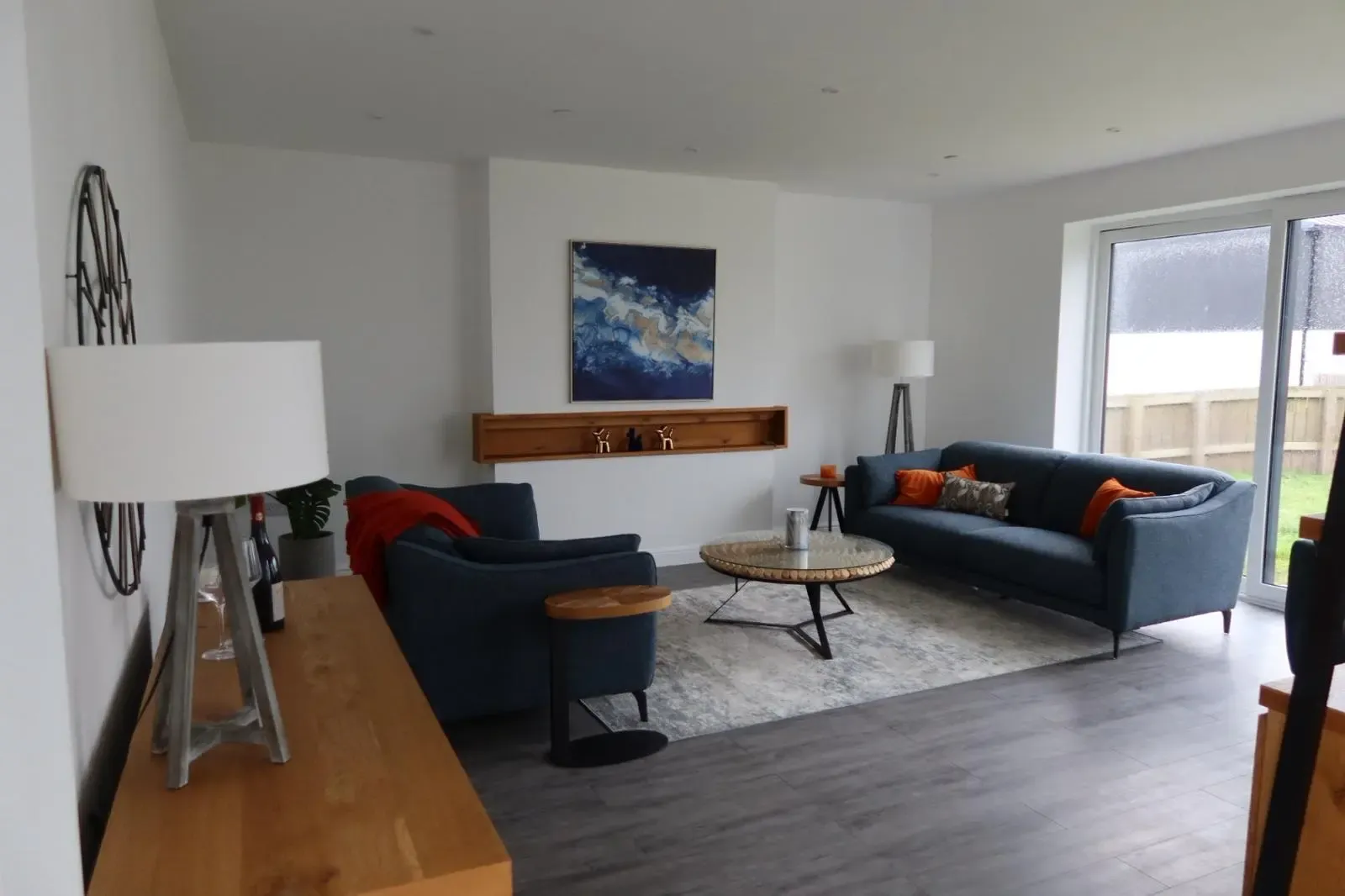 Perfectly smooth plastered and skimmed white walls in a modern South Wales living room completed by Global Plastering